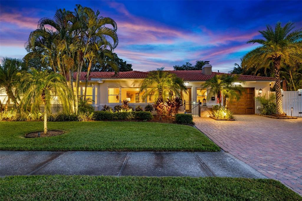 a view of a house with a yard