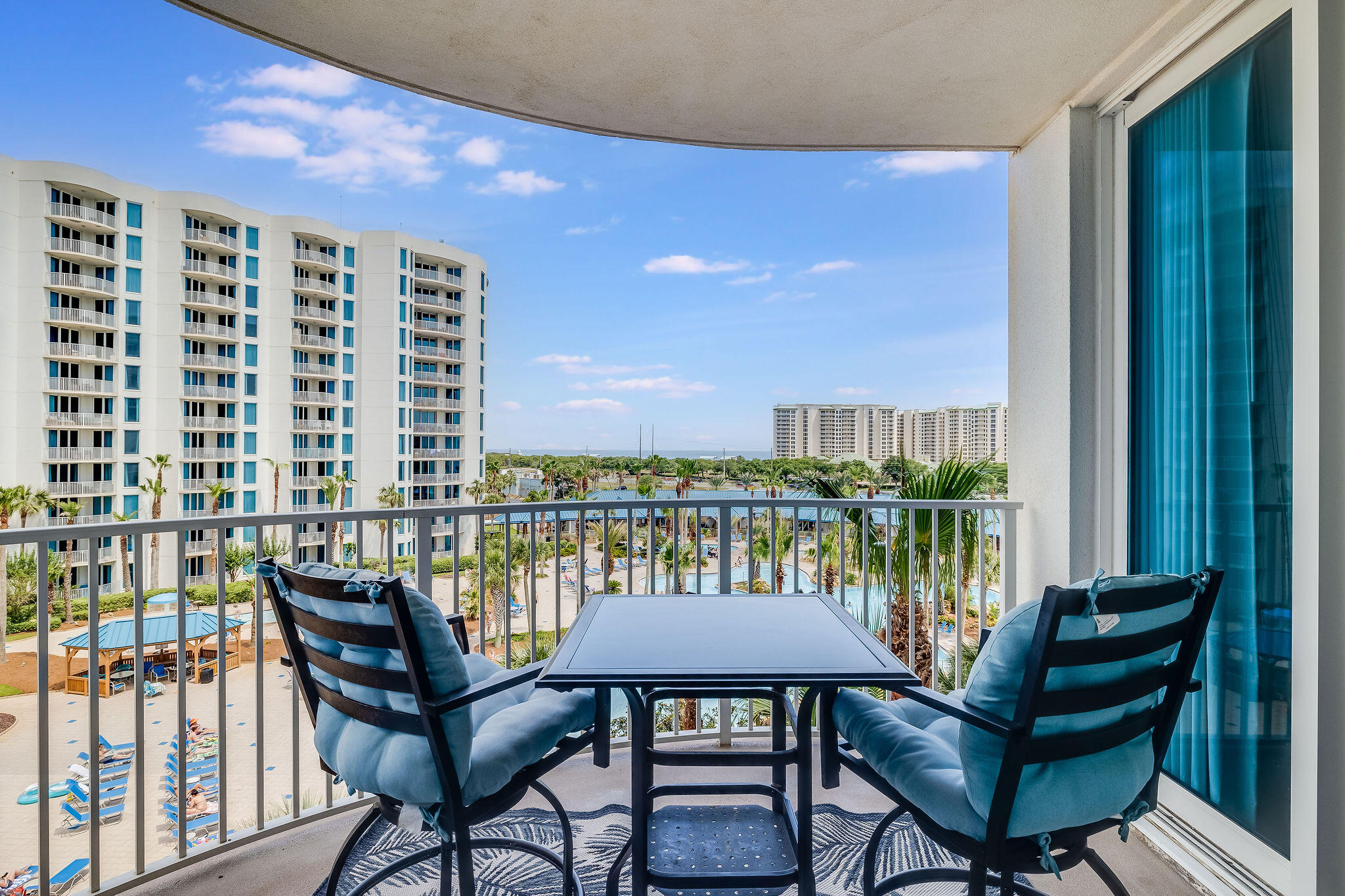 a view of a balcony with chairs