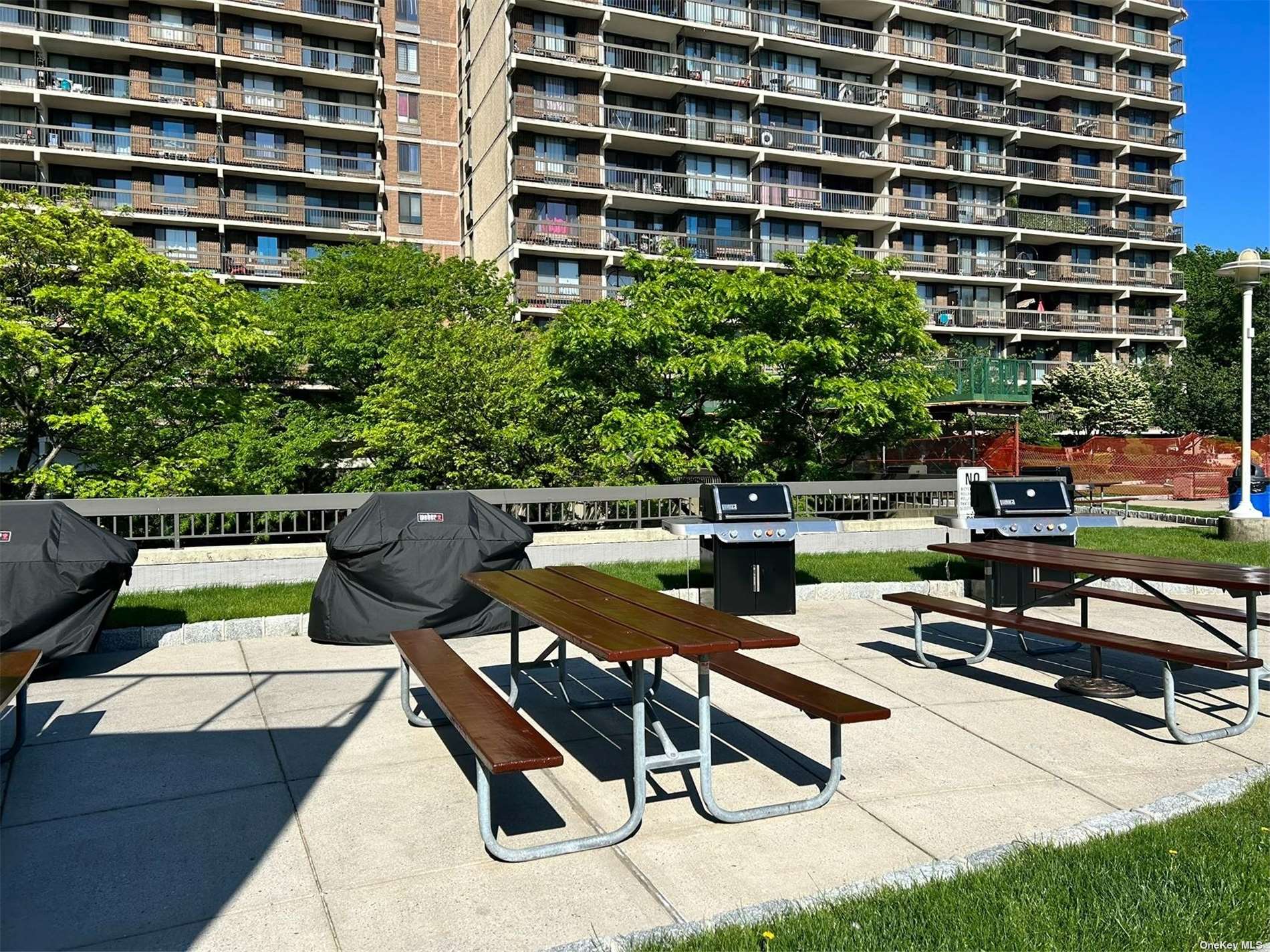 a view of a chairs and tables in the back yard of the house