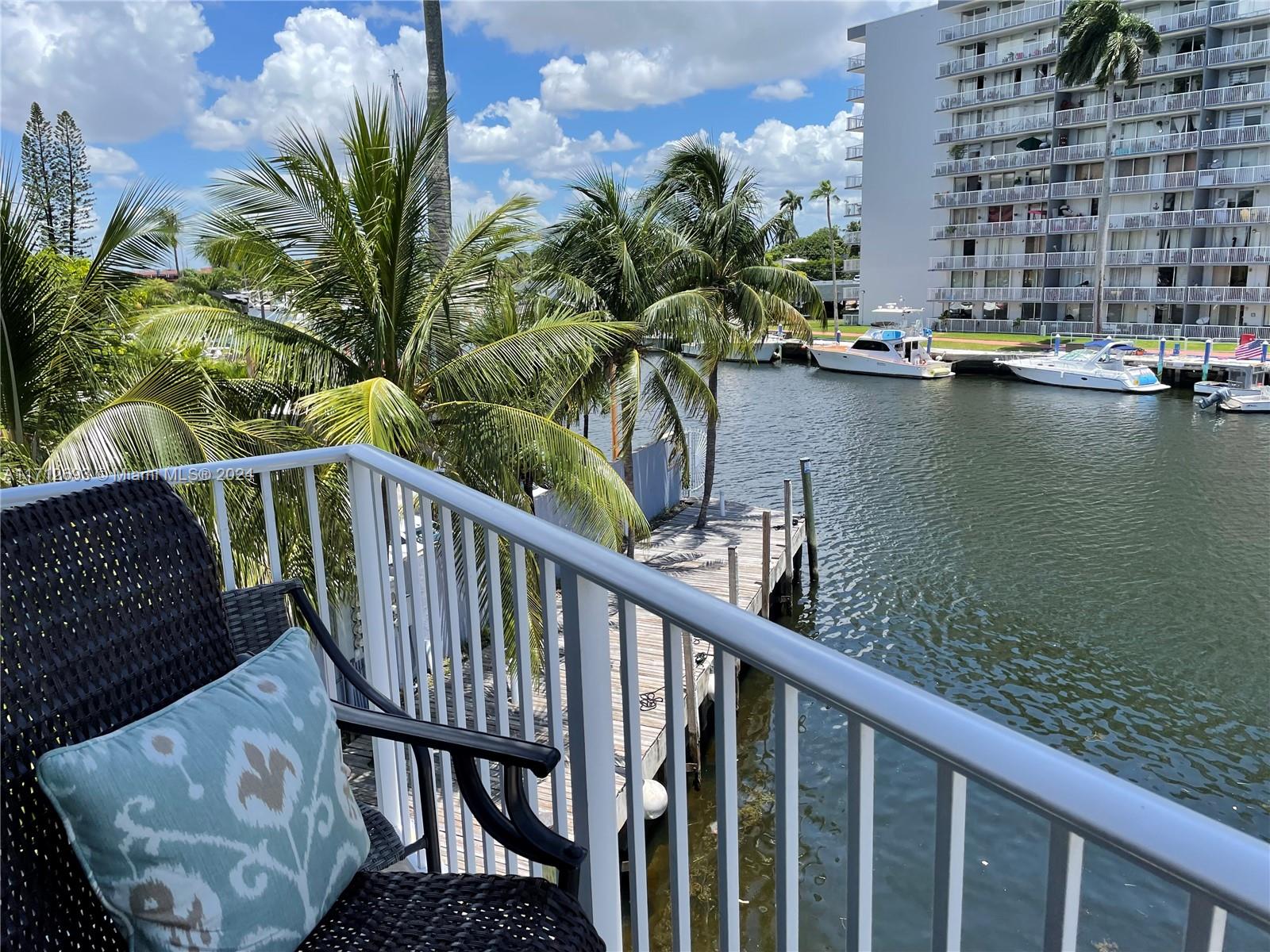 a view of a balcony with chairs