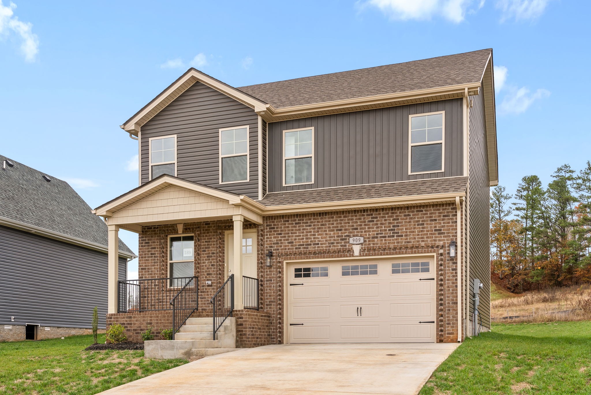 a front view of a house with a yard