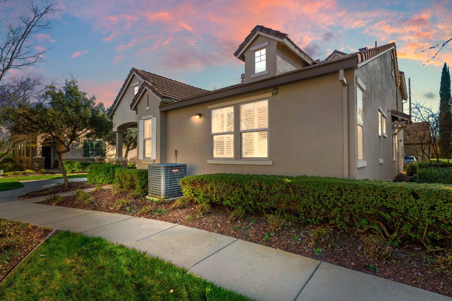 a front view of a house with garden