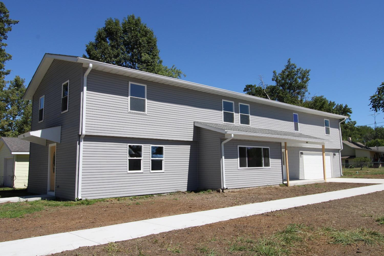 a front view of a house with a garage