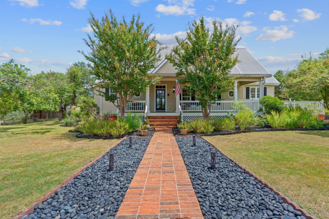 The picture-perfect quintessential farmhouse with amazing landscaping!