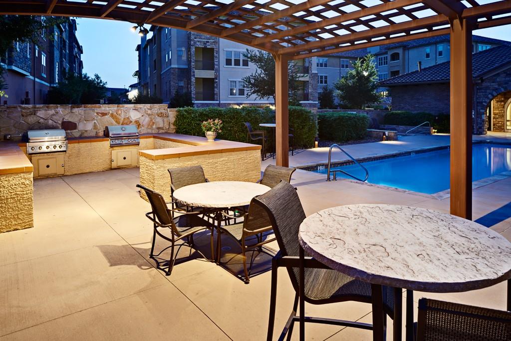 a outdoor space with a table and chairs