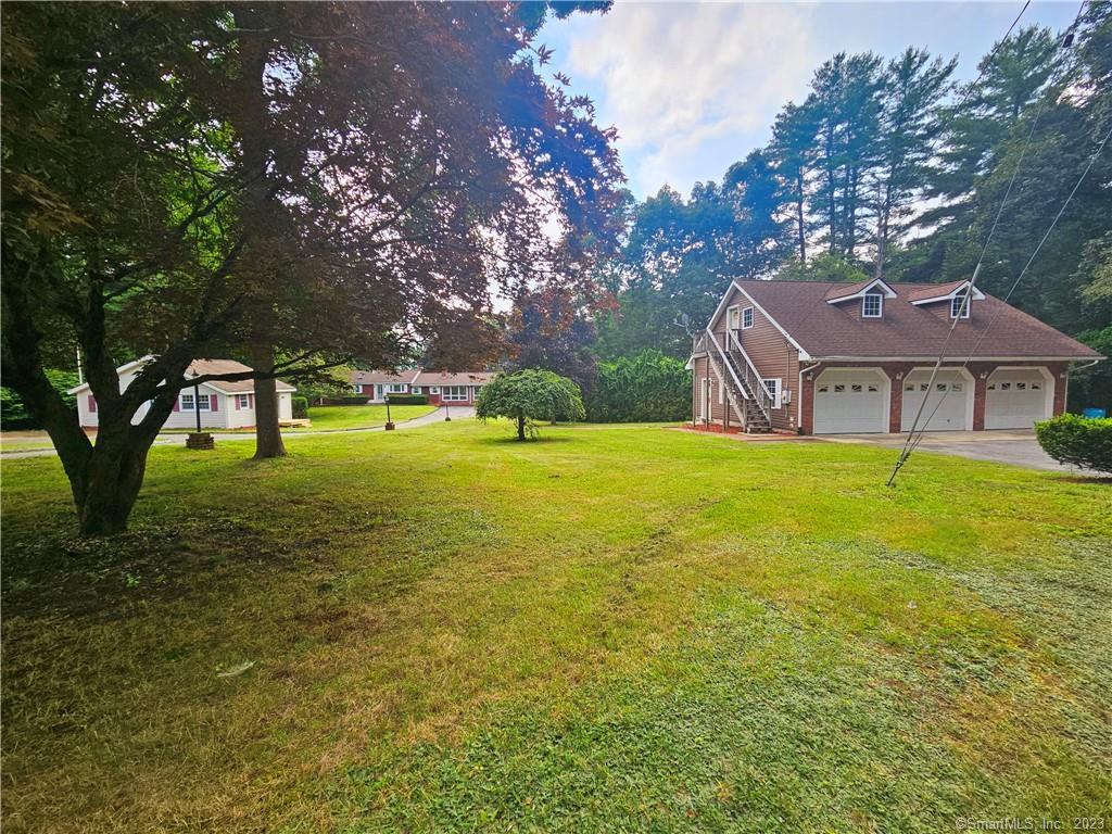 a view of a house with a yard