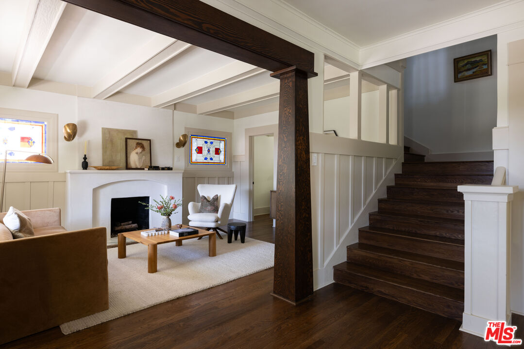 a living room with fireplace furniture and a fireplace