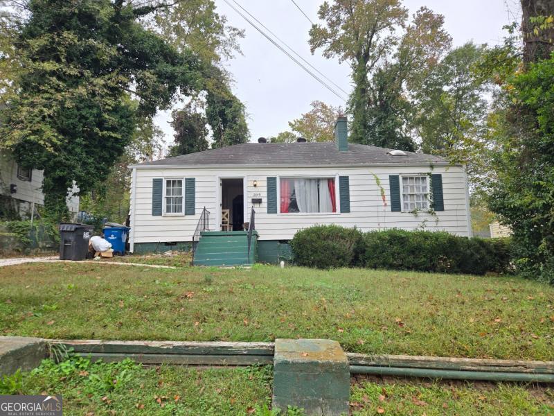 front view of a house with a yard