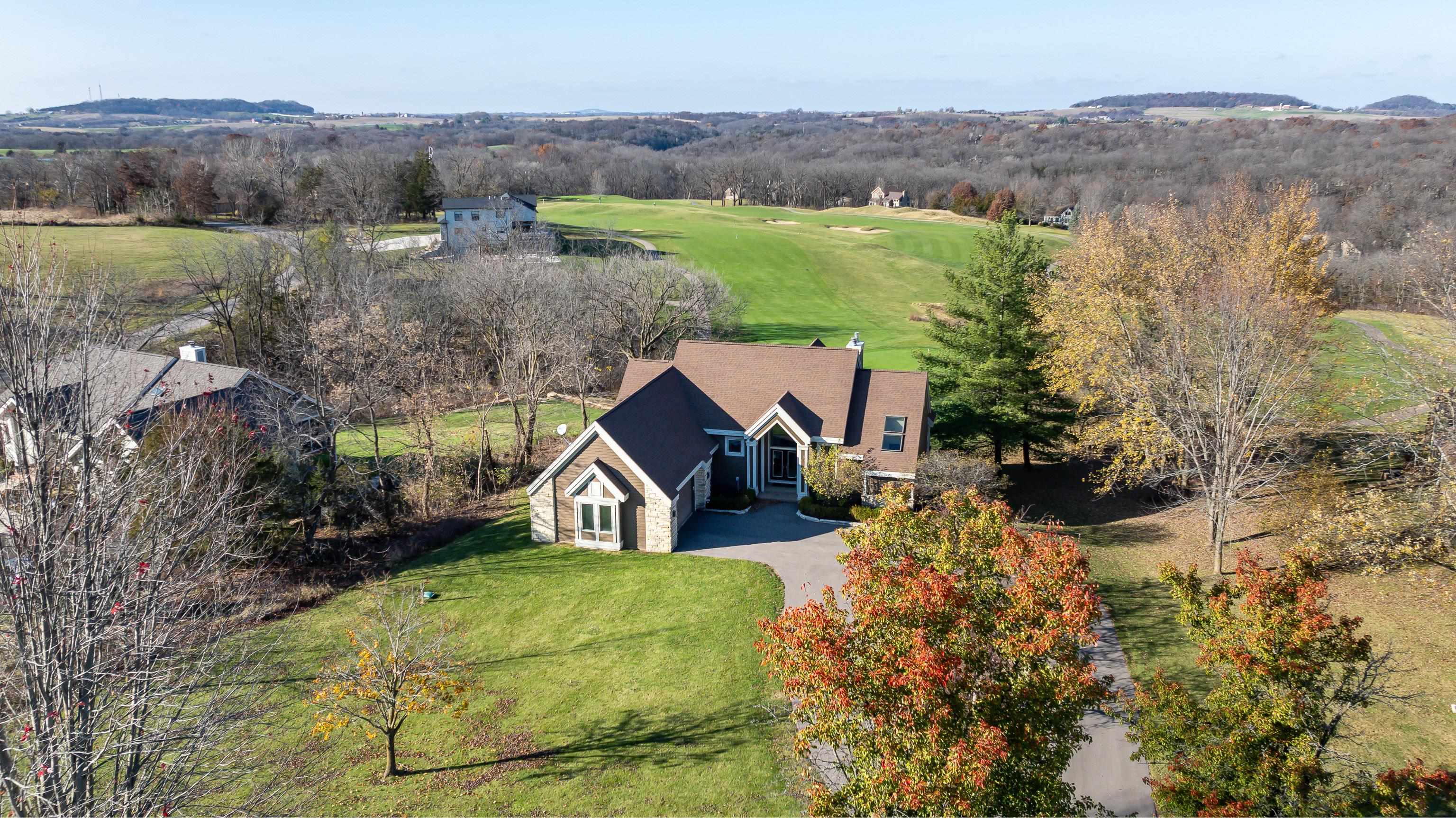 an aerial view of a house with mountain view