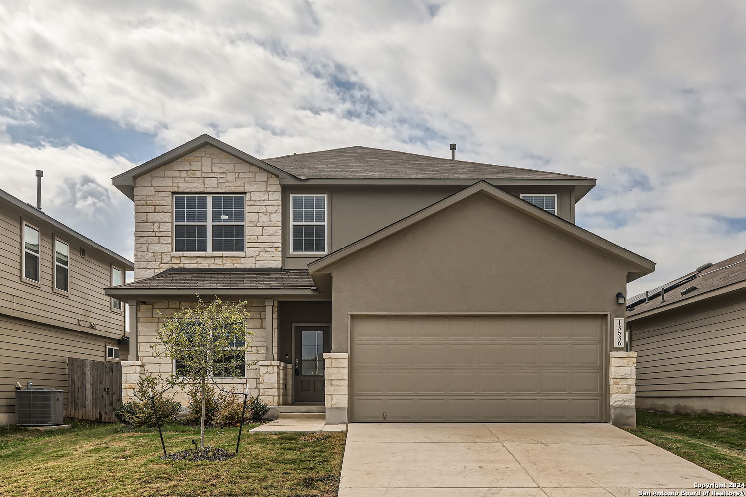 a view of a house with garage