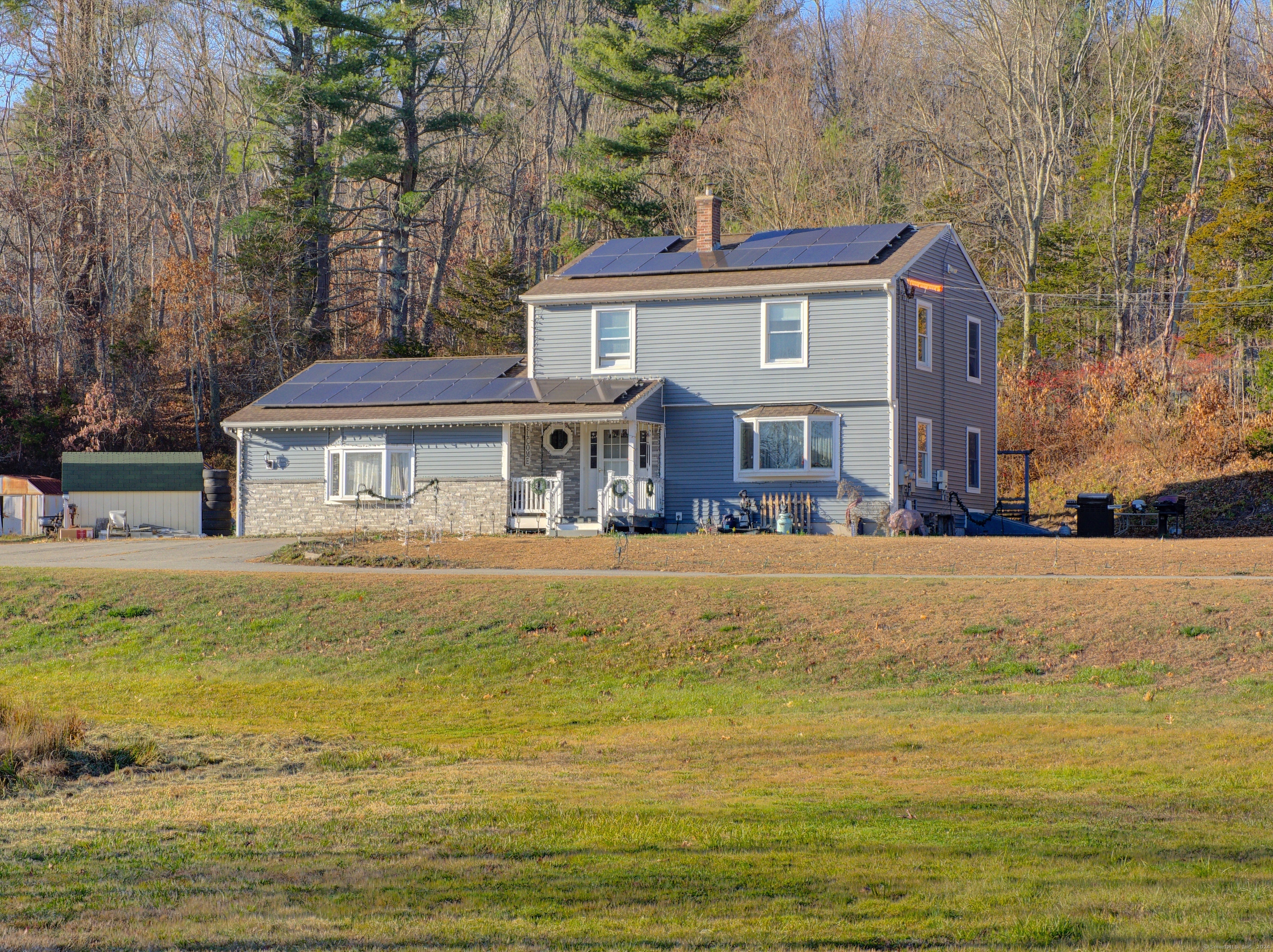 a front view of a house with a swimming pool