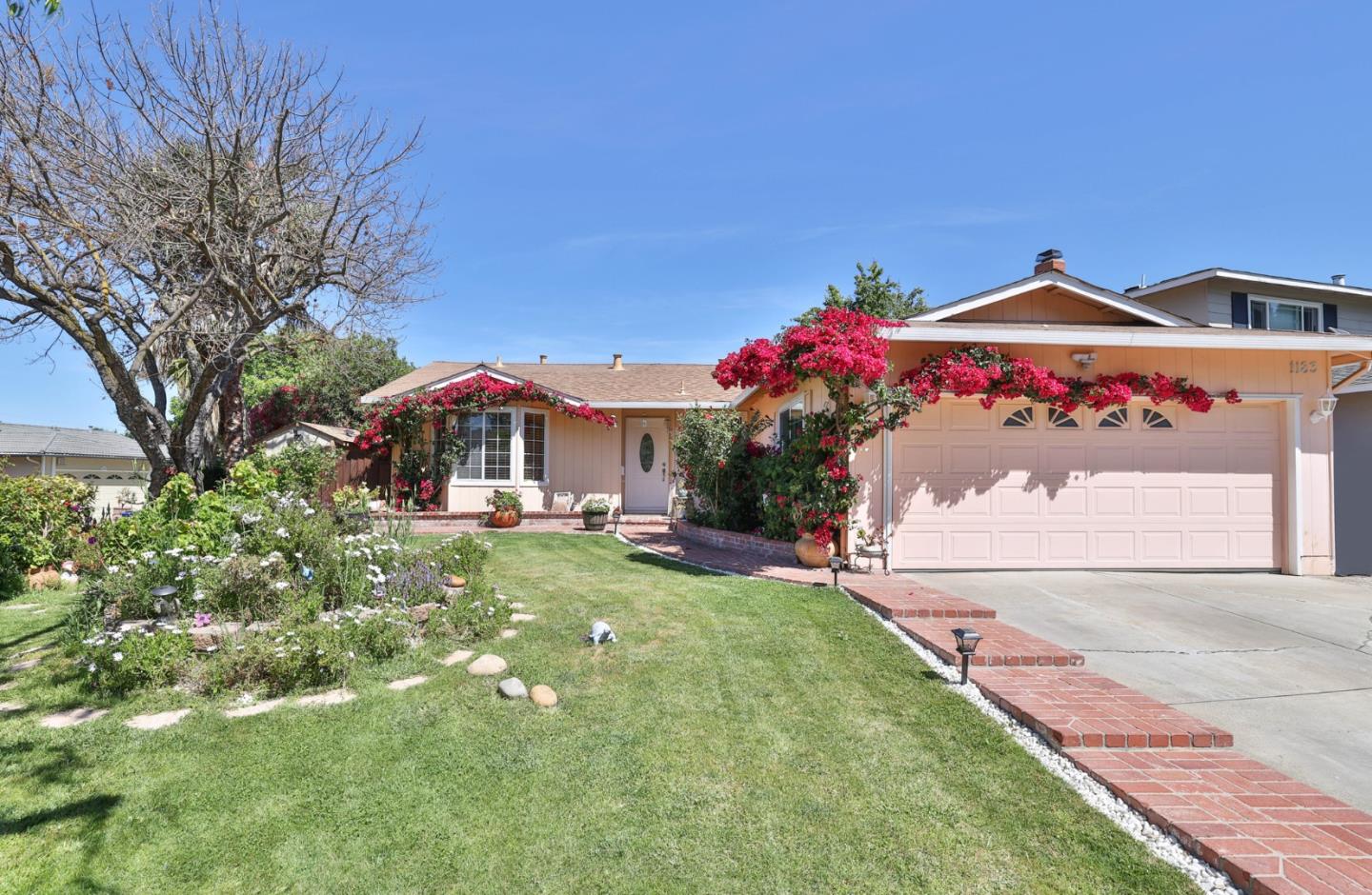 a front view of a house with yard