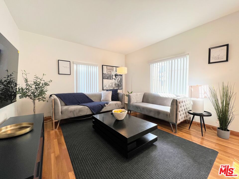 a living room with furniture and a rug