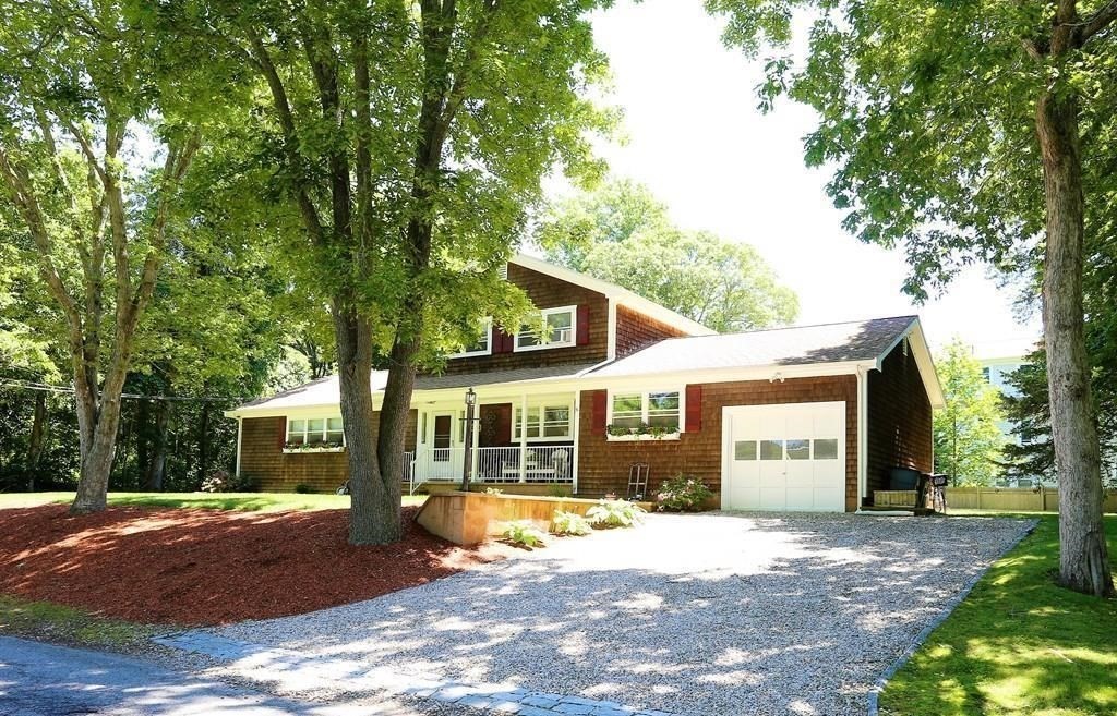 a house with trees in the background