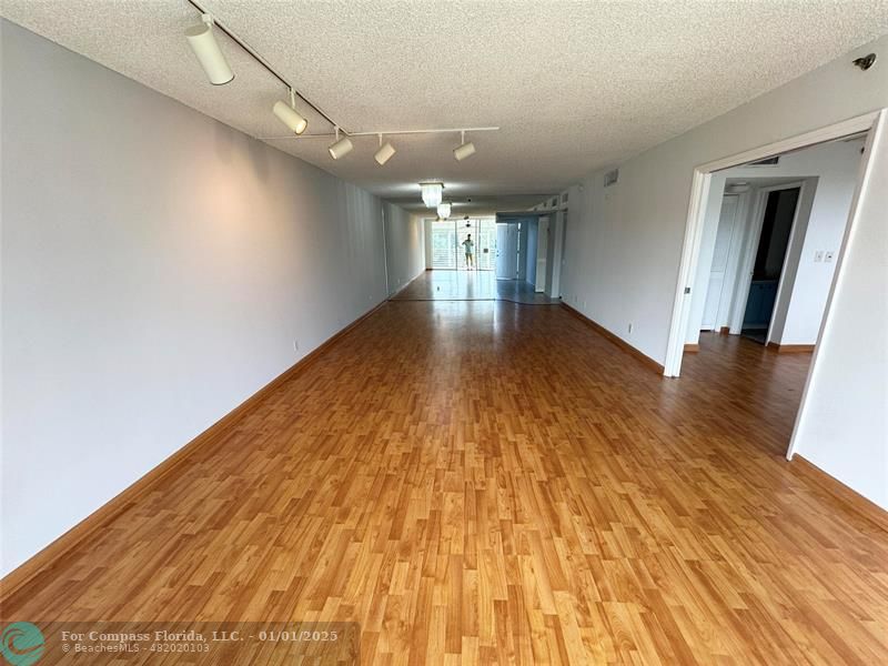 a view of gallery with wooden floor