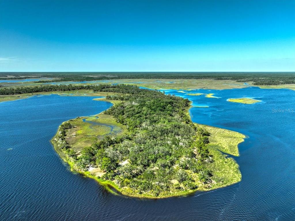 a view of a lake with a yard