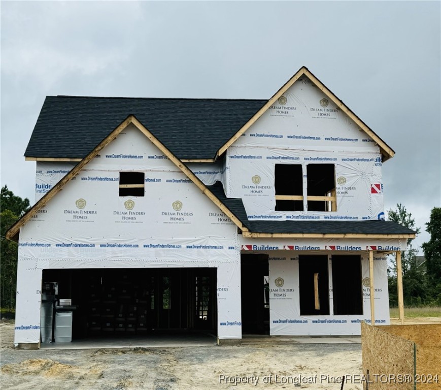 a front view of a house with garage