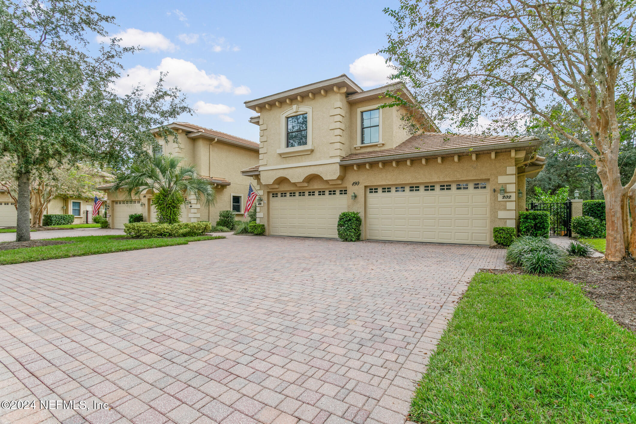 a view of a house with a yard and garage