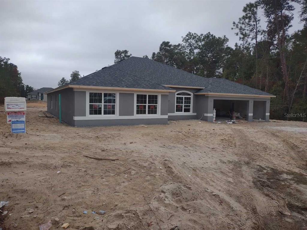 front view of a house with a yard