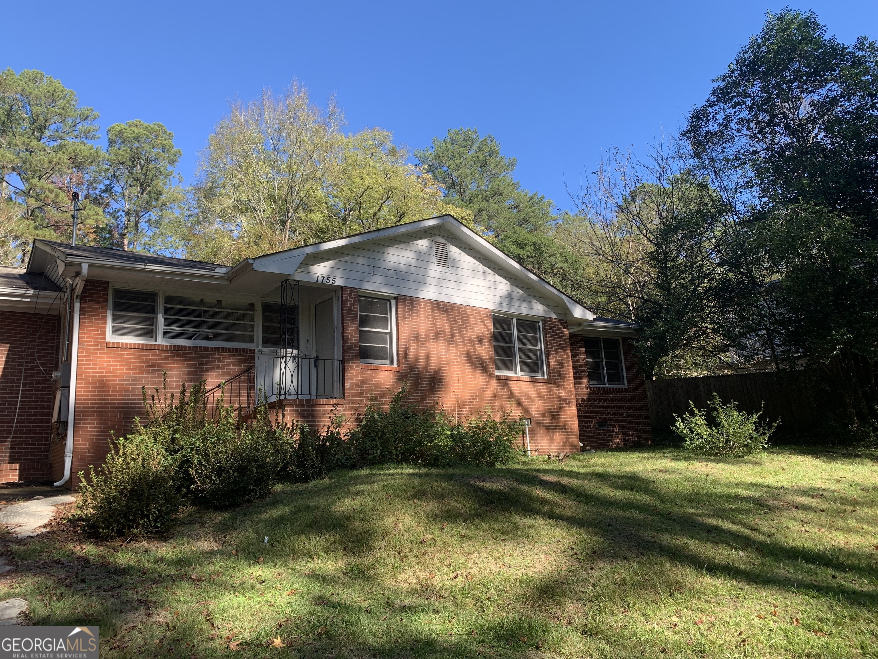 a front view of house with garden