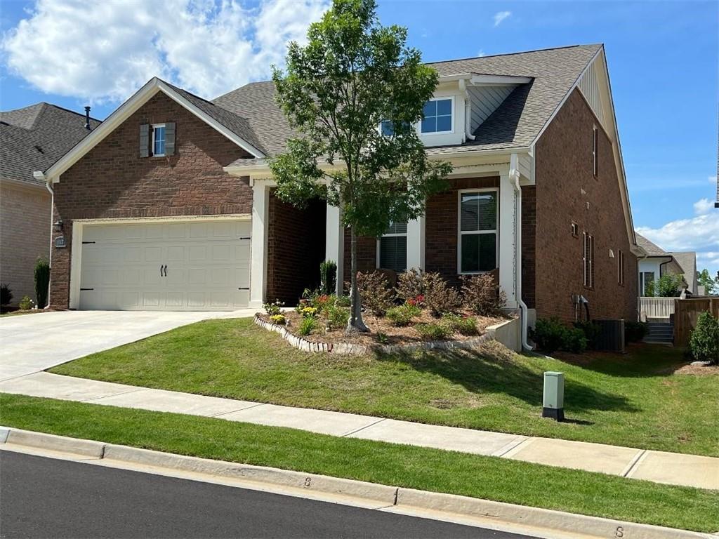 a front view of a house with garden