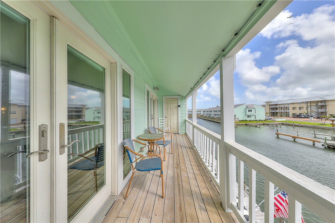 a view of balcony with furniture