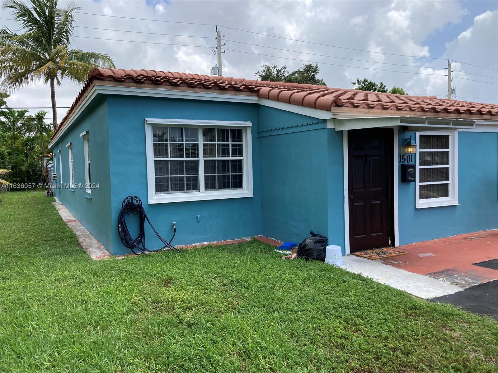 a view of an house with backyard space and porch