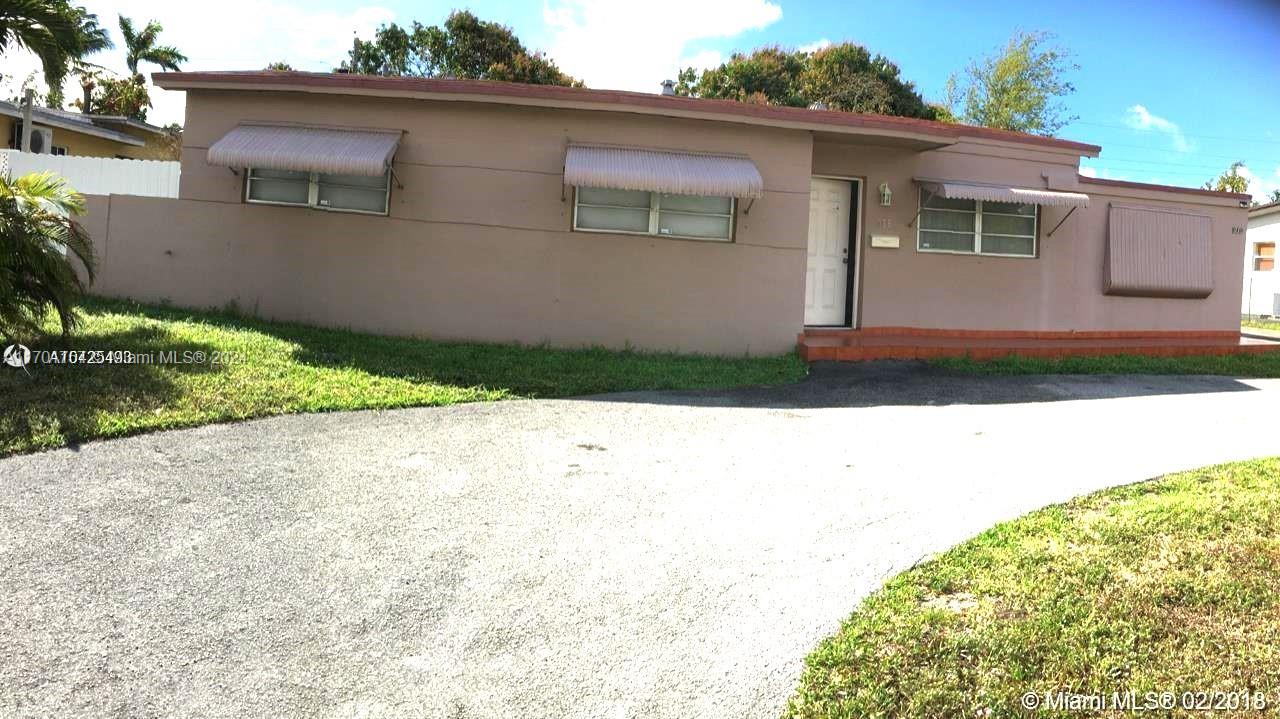 a side view of a house with a yard