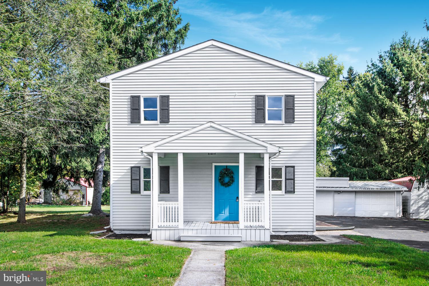 front view of a house with a yard