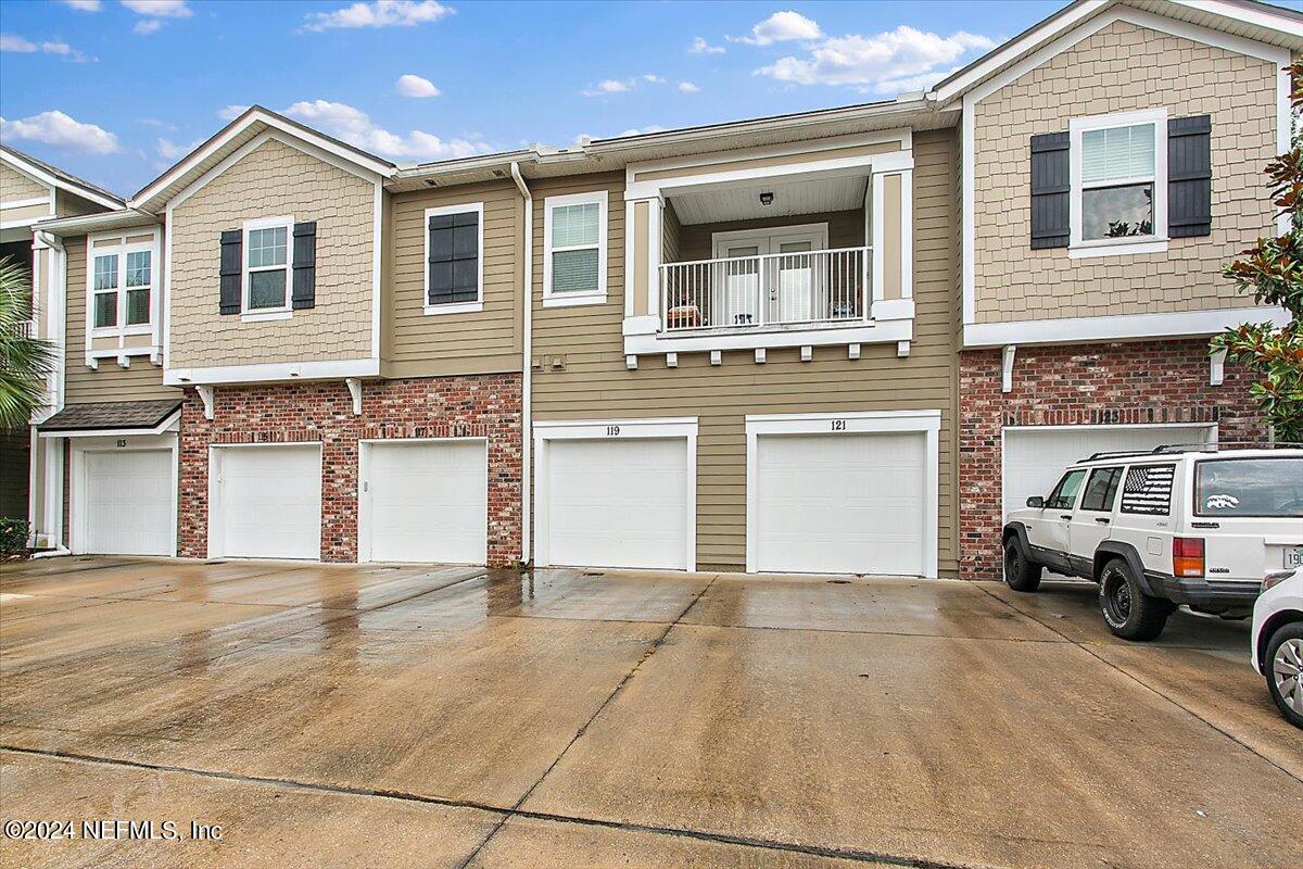 a view of a house with a parking space