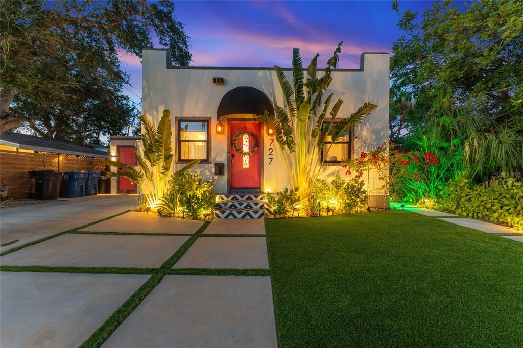 a front view of a house with garden