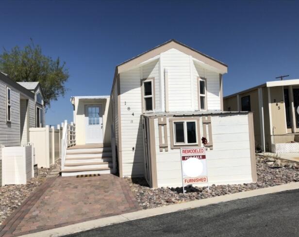 a front view of a house with a small yard