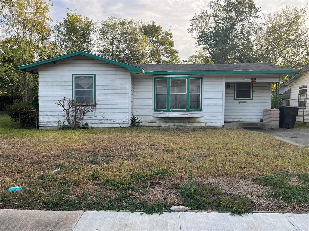 a house with yard in front of it