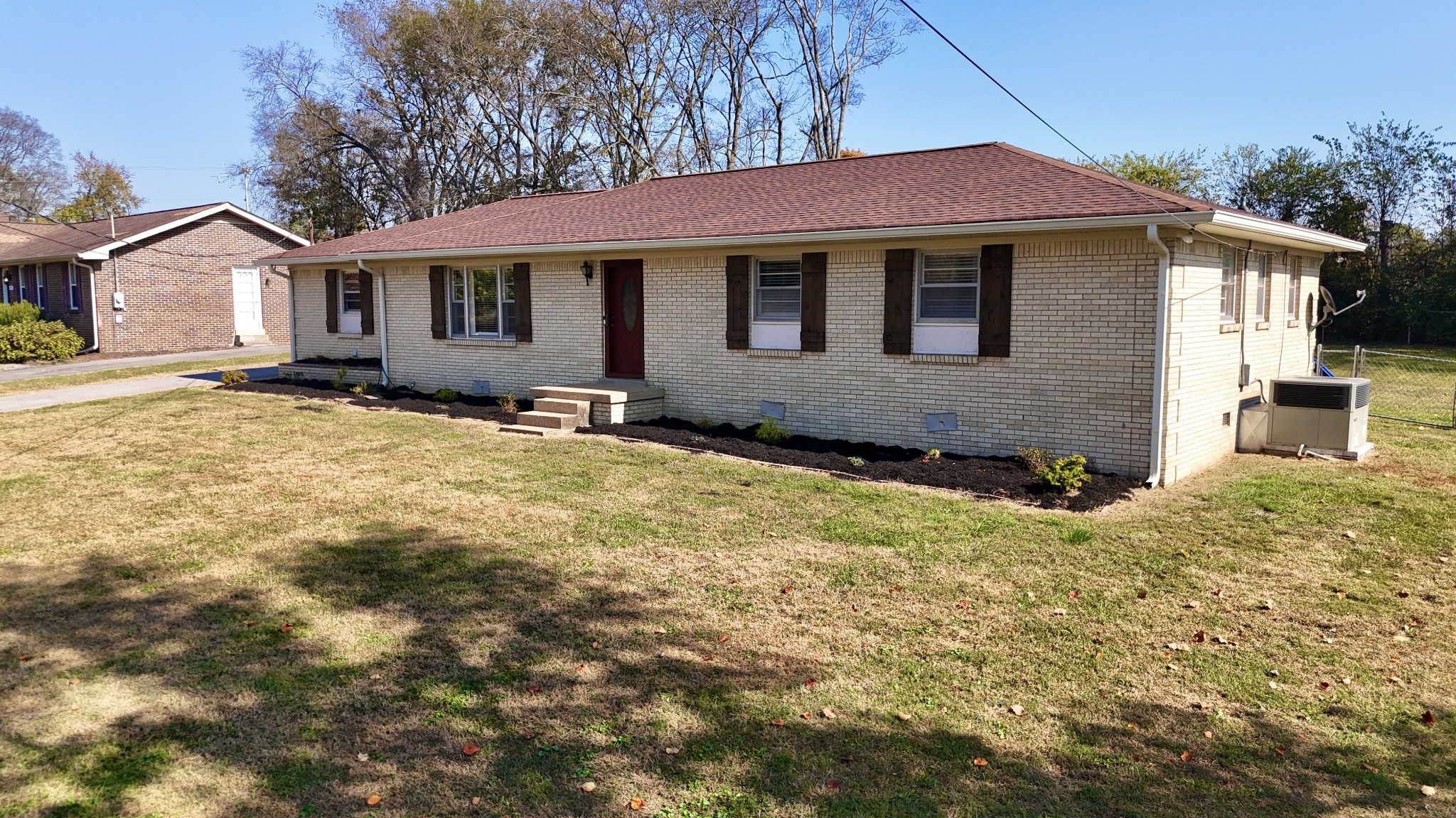 a front view of a house with a yard