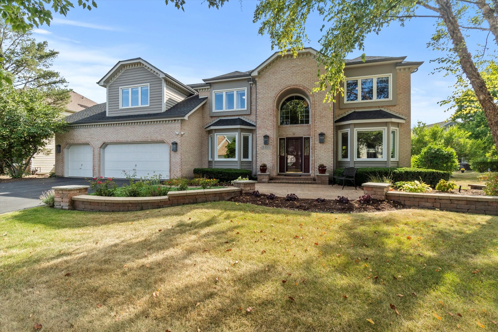 a view of a house with swimming pool and a yard