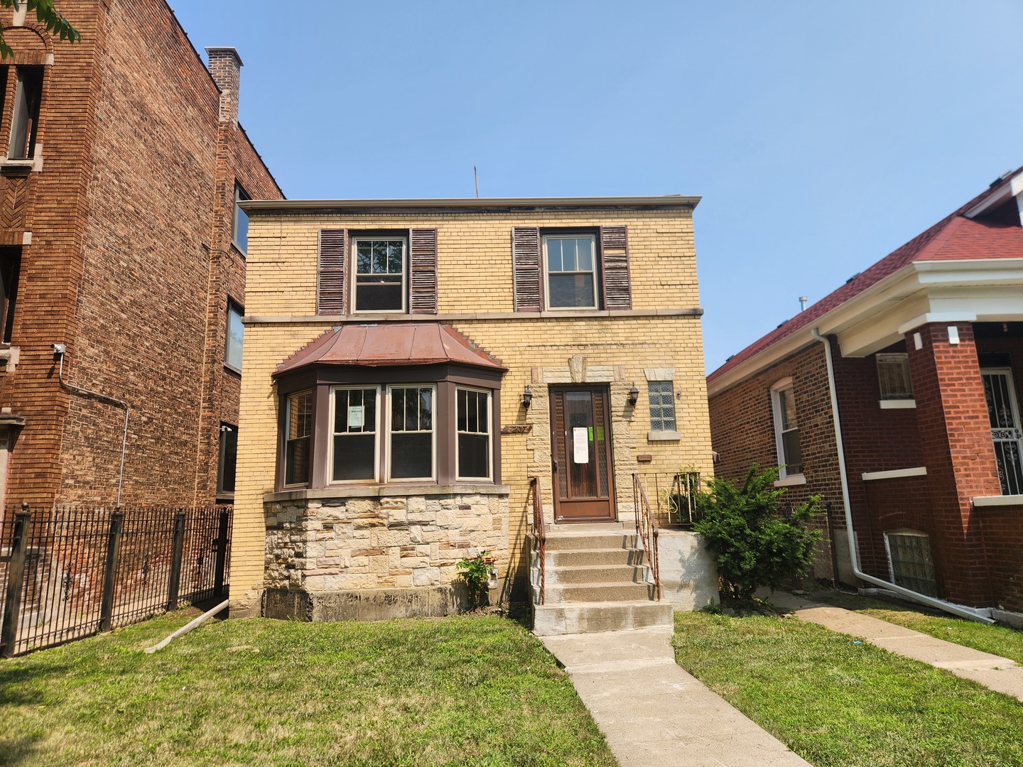 front view of a house with a yard