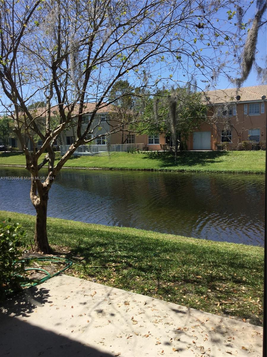 a view of a lake with a building in the background