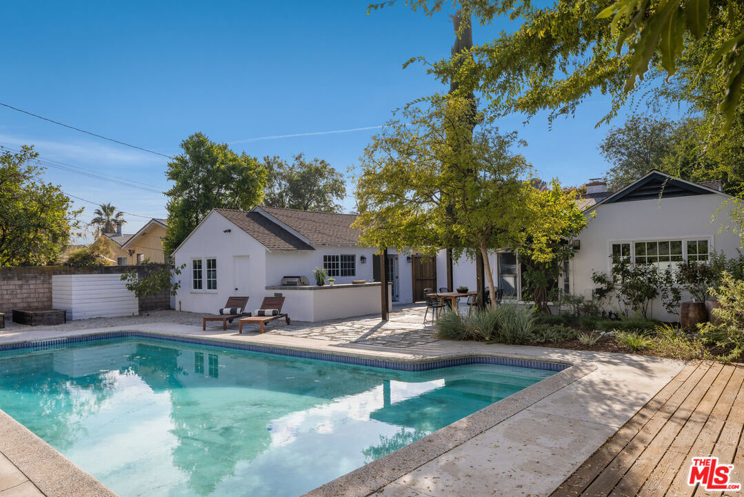 a house view with sitting space garden and patio