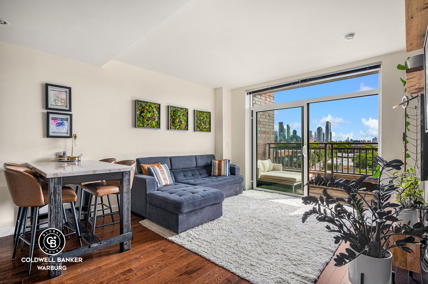 a living room with furniture and a floor to ceiling window