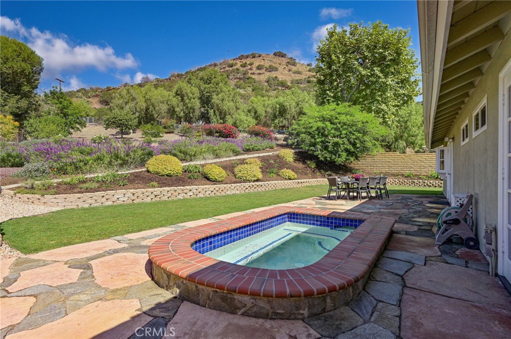 a view of a swimming pool with a outdoor seating