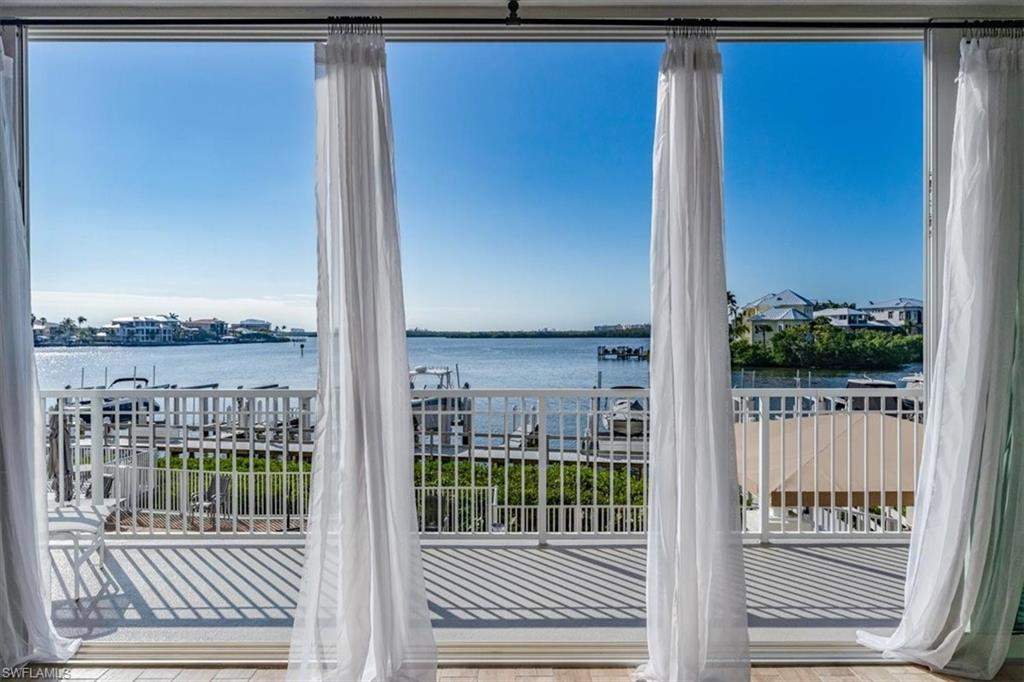 a view of a balcony with wooden floor