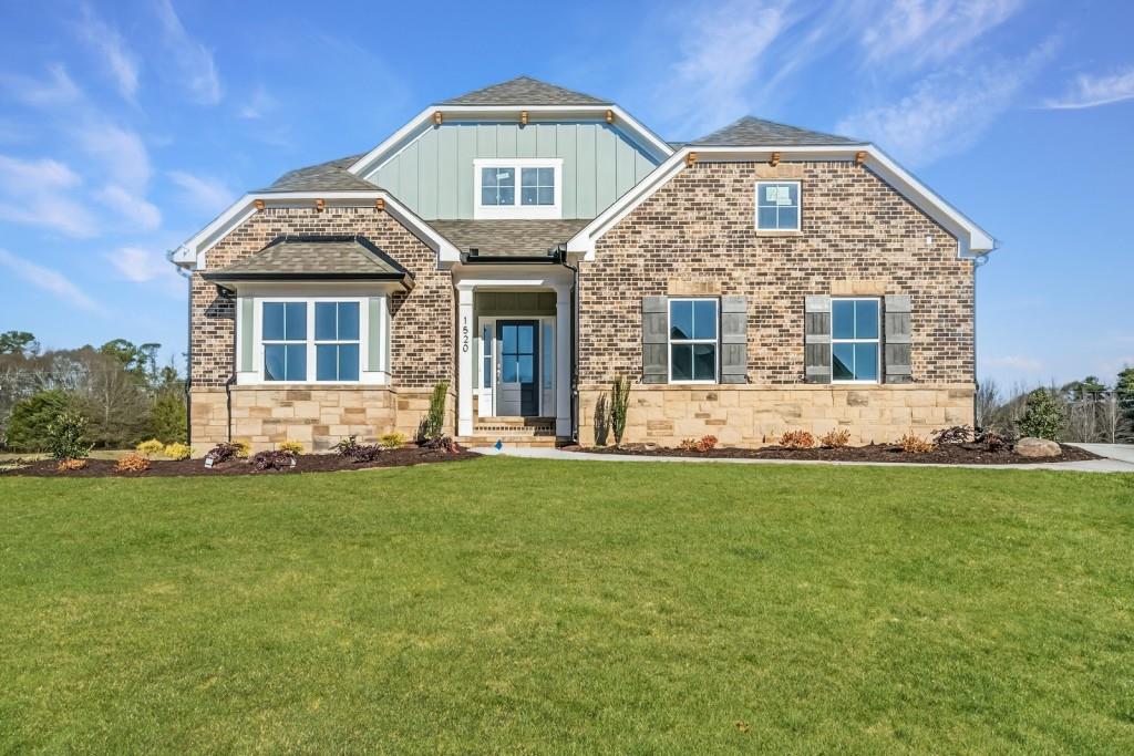 a front view of a house with a yard