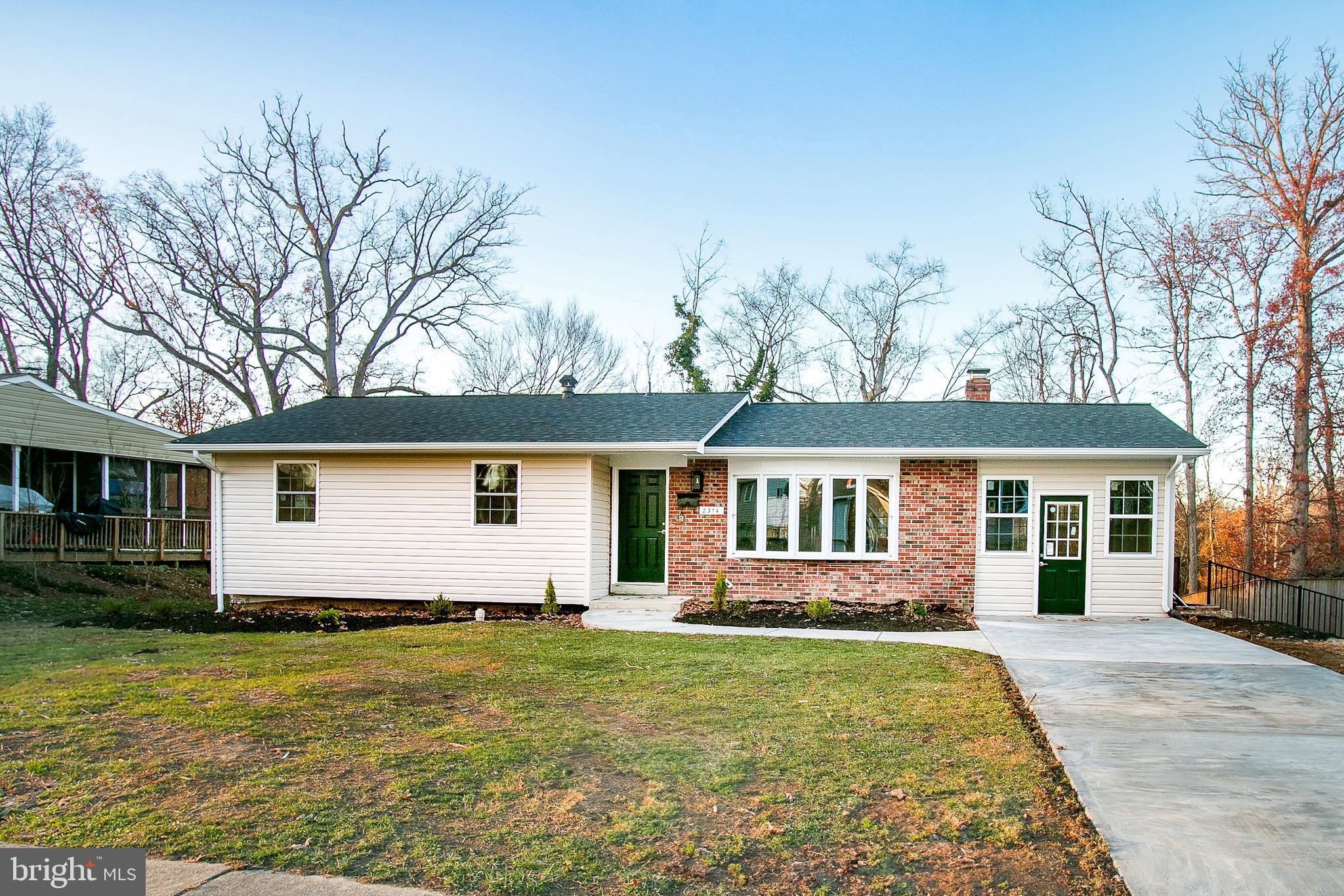 front view of a house with a yard