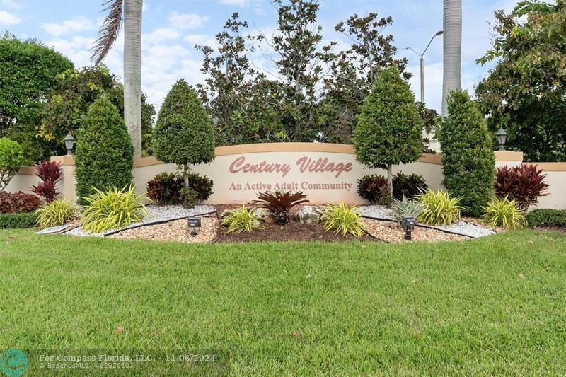 a view of a park with welcome board