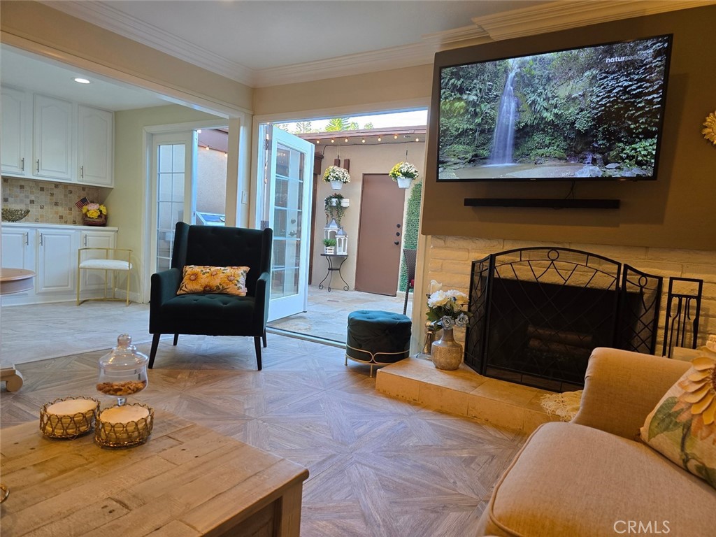 a living room with furniture and a fireplace