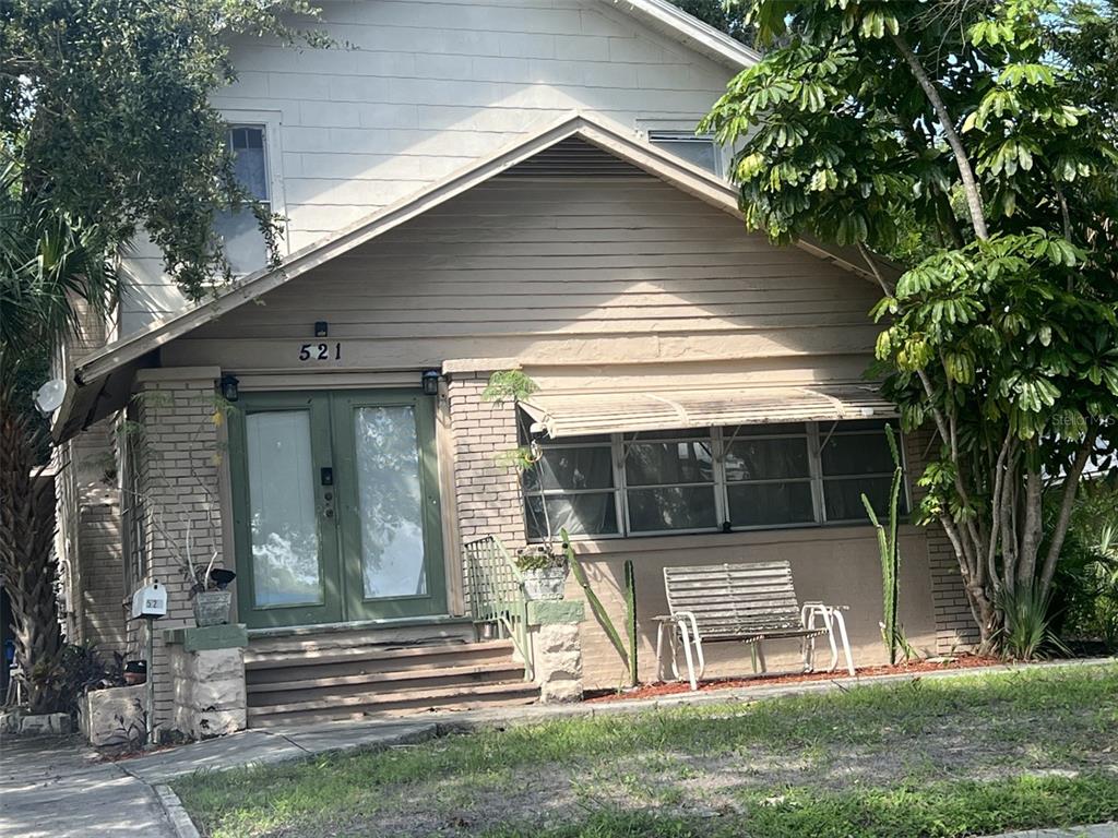 a view of a house with a yard