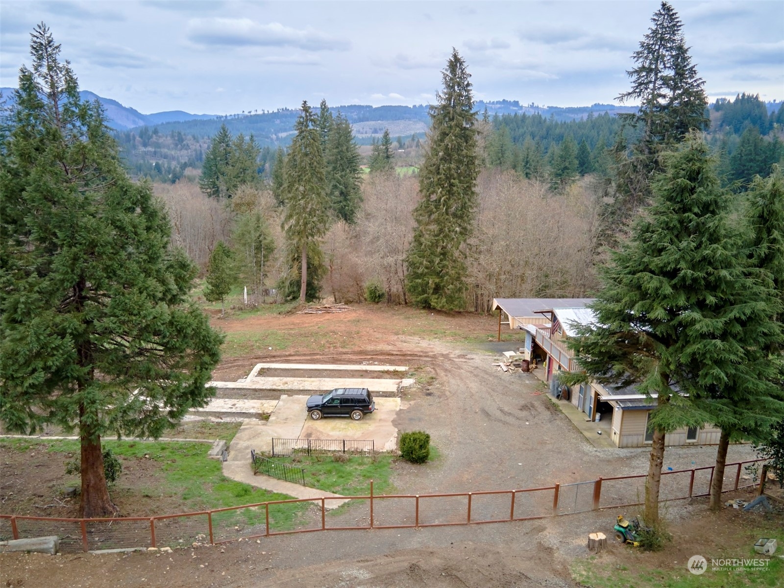 a view of a house with a yard and sitting area