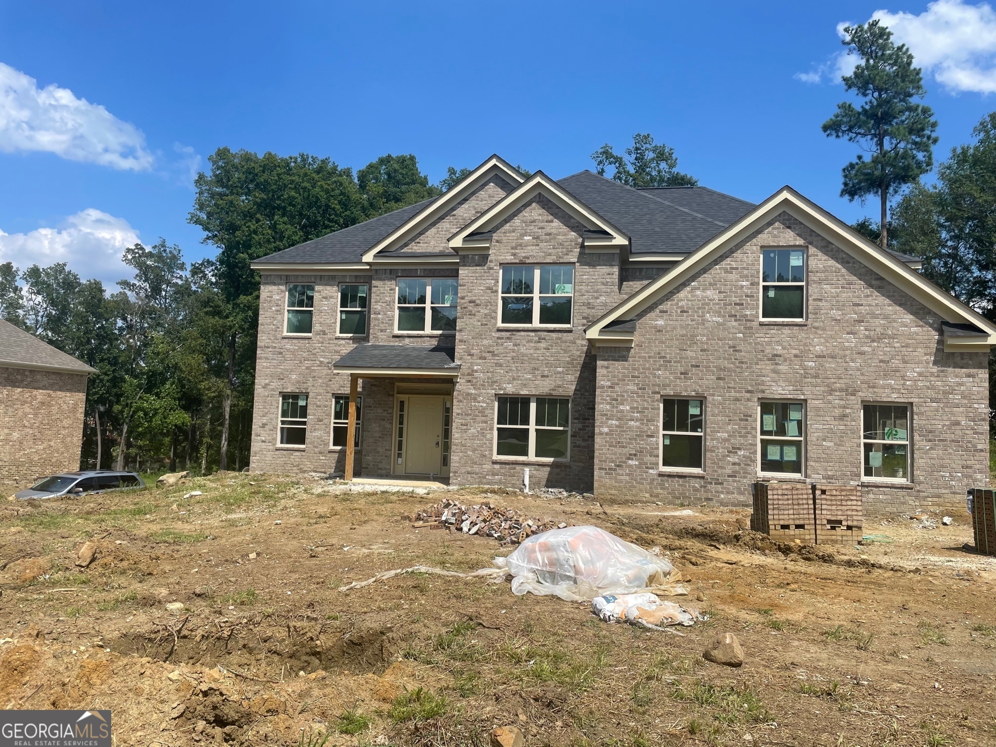 a front view of a house with a yard