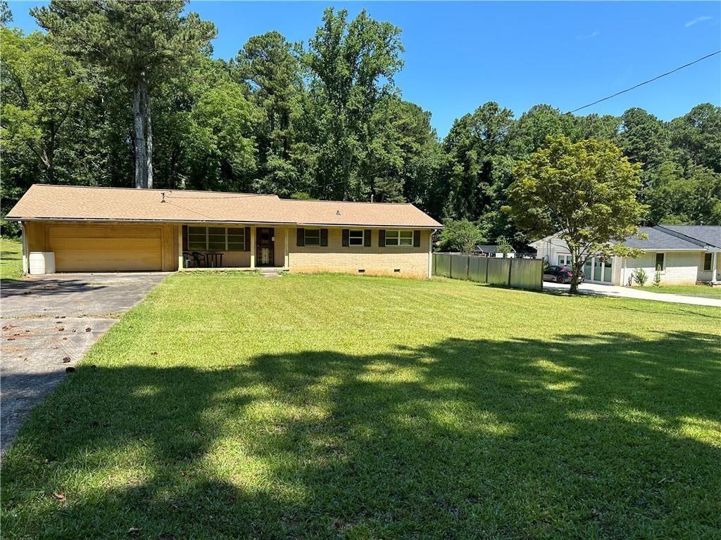 a view of a house with a big yard