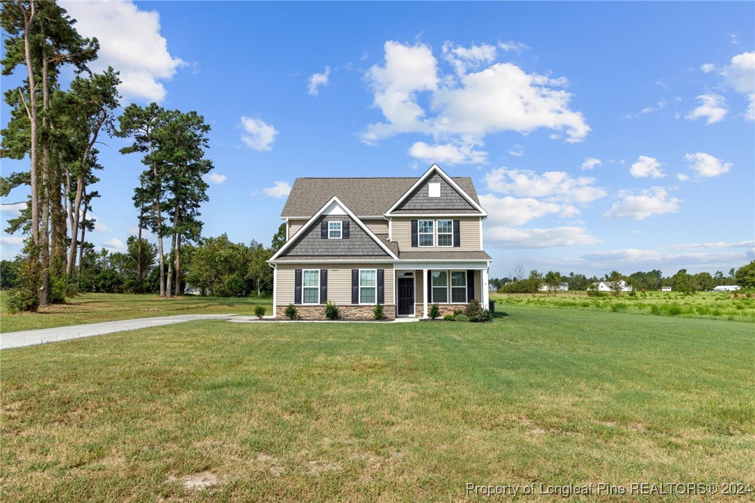 a view of a house with a big yard